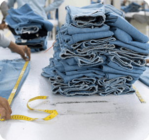 Stacked denim with measuring tape